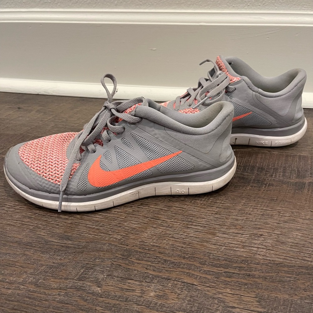 Light grey & orange Nike free tennis shoes